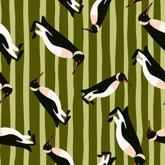 Random seamless pattern with hand drawn penguins abstract ornament. Olive green striped background.