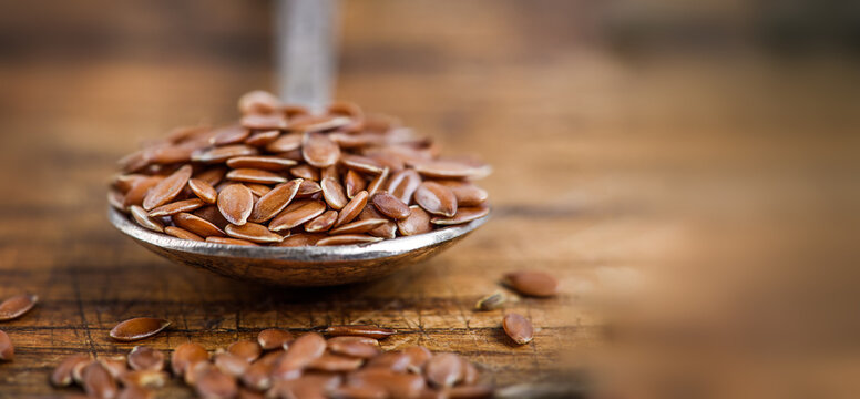 Close Up Flax Seed In Old Spoon , Super Food With Hight Of A Fiber Nutrient And Anti Inflammatory Omega-3 Fatty Acids