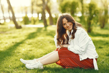 Stylish woman spending time in a spring park