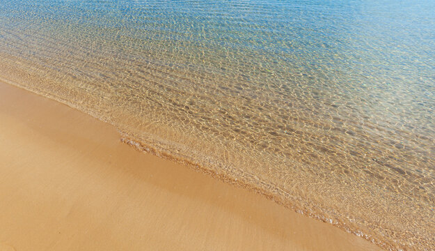 Sandy beach and crystal clear waters in the beach of Santa Maria, in Paros island, Cyclades islands, Greece, Europe.