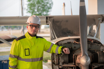 Technician fixing the engine of the airplane,Female aerospace engineering checking aircraft engines,Asian mechanic maintenance inspects plane engine