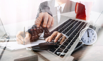 Healthcare costs and fees concept.Hand of smart doctor used a calculator for medical costs in modern hospital