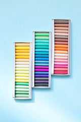 Colorful chalk crayons for drawing on a blackboard and on asphalt.
