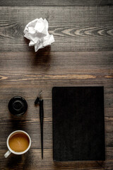 Writer workplace with tools on wooden background top view mock up