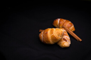 homemade mini croissants on black background