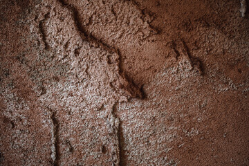 Abstract clay wall texture and colours background with imperfections and cracks. Terracotta