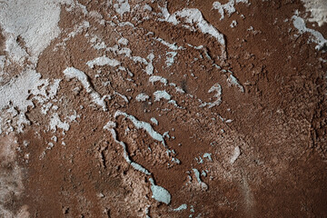 Abstract clay wall texture and colours background with imperfections and cracks. Terracotta