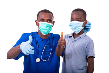 doctor with child wearing medical mask showing thumbs up togethe