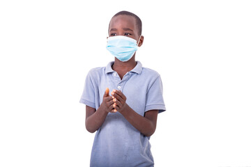 little boy wearing a medical mask.