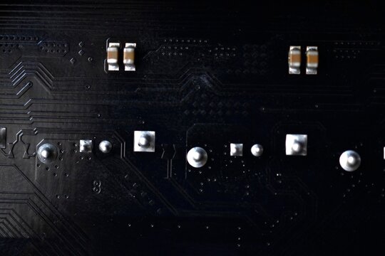 Black Computer Chip Close-up With Elements And Tracks