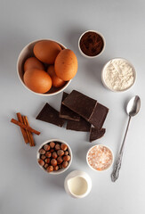 Ingredients: flour, eggs, chocolate, milk and spices for baking chocolate cupcake or brownie