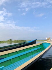 Inle Lake, Myanmar - November 9, 2019: Boat navigating through floating gardens in Inle Lake