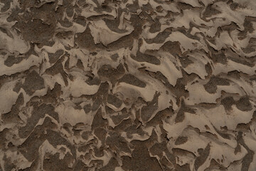 Rippled golden brown desert sand Texture background