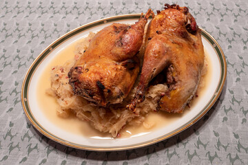 Roast or Braised Pheasant on Sauerkraut, on a Plate, in Traditional Alsatian Style