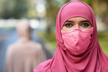 Arab Young Lady Wearing Protective Face Mask Posing Outdoors