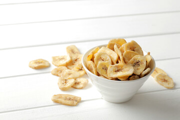 .dried banana on white background.Homemade Dehydrated Banana Chips.
