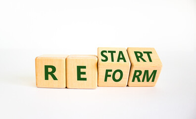 Restart and reform symbol. Turned cubes and changed the word 'restart' to 'reform'. Beautiful white background. Business and restart - reform concept. Copy space.