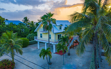 Fototapeta na wymiar Beautiful sunrise photos of Florida Keys living. Tranquil peace and palm trees