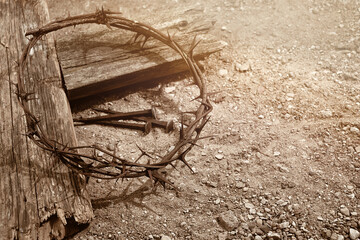 Crucifixion Of Jesus Christ. Cross With three Nails And Crown Of Thorns on ground.