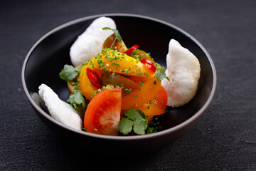 Salad of various tomatoes, healthy vegan food