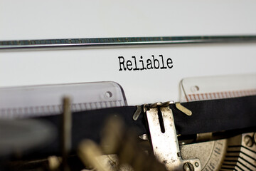 Reliable symbol. The word 'reliable' typed on retro typewriter. Business, reliable concept....