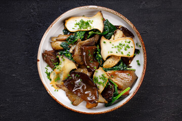 Vegan saute with mushrooms, aubergines and spinach