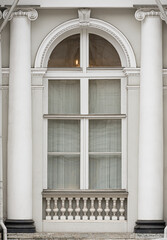  Windows in the city in the old style, with stucco, decorative elements