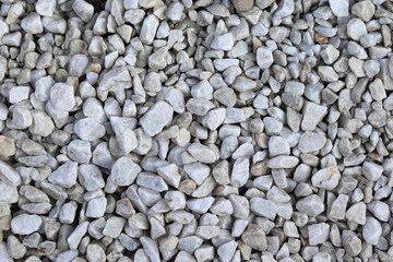 Gray gravel background - small stones. Stone aggregate