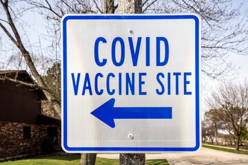 A sign in a suburban neighborhood shows a new Covid vaccine site in Deerfield, Illinois.