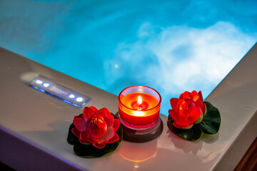 Hot tub with candles and water lilies
