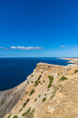 Fototapeta na wymiar Cape Fiolent in Crimea. Beautiful views of the Black Sea coast at Cape Fiolent in summer. Sea coast with turquoise water and rocks