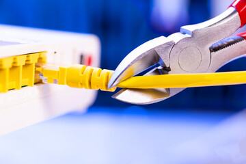 A cutter for cutting a network cable cuts a cable close-up,