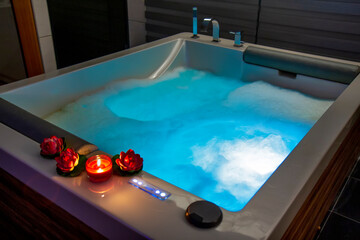 Hot tub with candles and water lilies