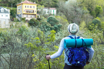 lonely Pilgrim with backpack walking the Camino de Santiago in Spain, Way of St James