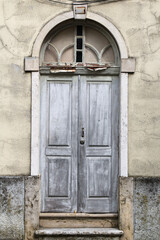 Fototapeta na wymiar grey rustic portuguese style wooden door