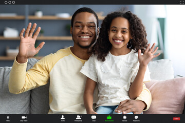Happy african american family kid and dad having video call