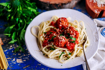 Italian meatballs in tomato sauce with pasta..style rustic