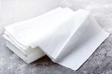 Paper napkins on grey background