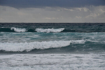 Fototapeta premium Mediterranean Sea waves rolling ashore during stormy weather in Ayia Napa, Cyprus