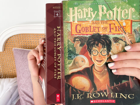Child reading Harry Potter novel by J.K. Rowling on March 30, 2021 in Charleston, South Carolina