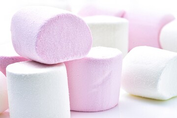 Heap of delicious White and pink marshmallows, isolated on white background