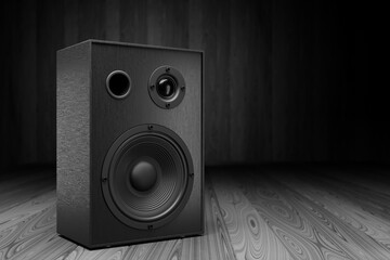 Black music speaker on a dark background. Empty space for your design. 3d rendering.