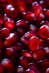 Close-up background texture pattern view of pomegranate fruit seeds.