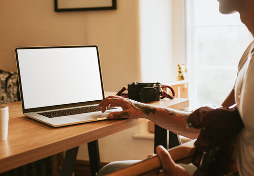 Hipster Guy Using Laptop Mockup
