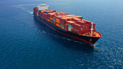 Aerial drone photo of container cargo ship in import export business commercial trade logistic and...