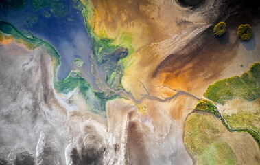Dry lake or swamp in the process of drought and lack of rain or moisture, a global natural disaster - aerial drone view