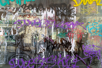 Moscow. Russia. March 29, 2021 . Inscriptions of graffiti on the glass window of a closed store.
