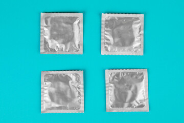 Condom on a blue background. The concept of safe sex.