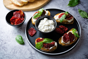 Ricotta dried tomato Basil bruschetta