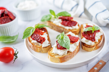 Ricotta dried tomato Basil bruschetta